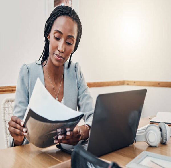 Black woman with business documents, small business entrepreneur working on strategy and planning online marketing. Learning startup industry vision, laptop for advertising company and technology job