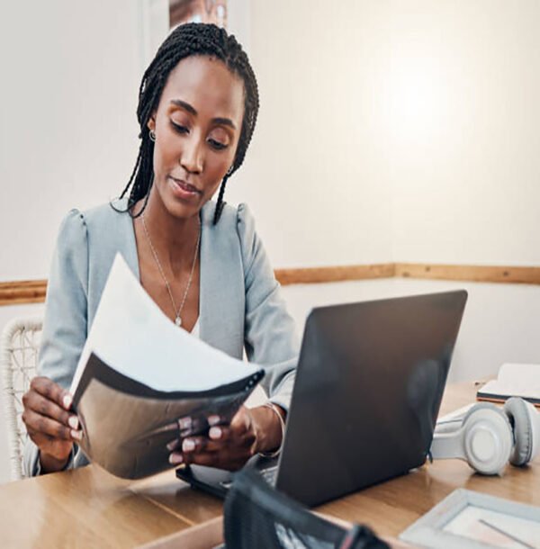 Black woman with business documents, small business entrepreneur working on strategy and planning online marketing. Learning startup industry vision, laptop for advertising company and technology job