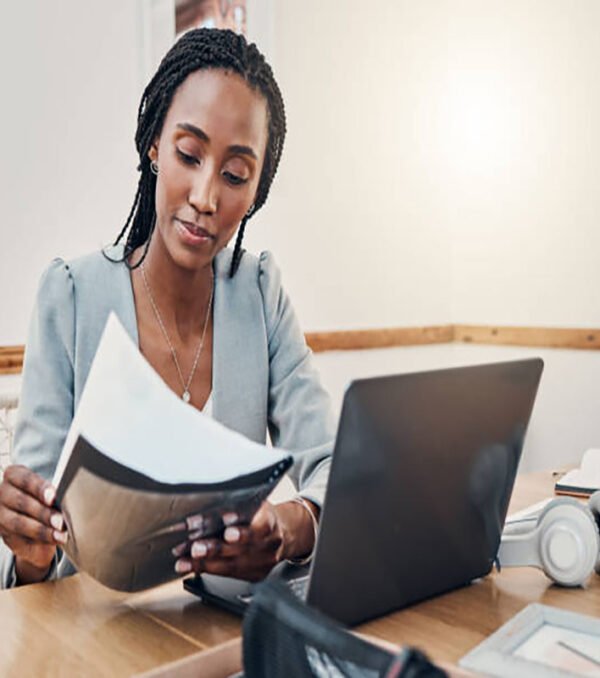 Black woman with business documents, small business entrepreneur working on strategy and planning online marketing. Learning startup industry vision, laptop for advertising company and technology job